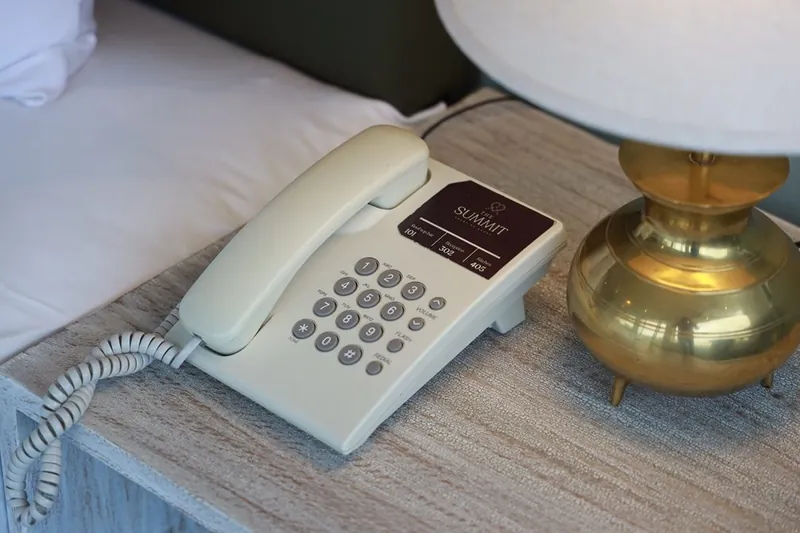 In-room telephone and bedside lamp, a guest-room amenity at The Summit Kandy