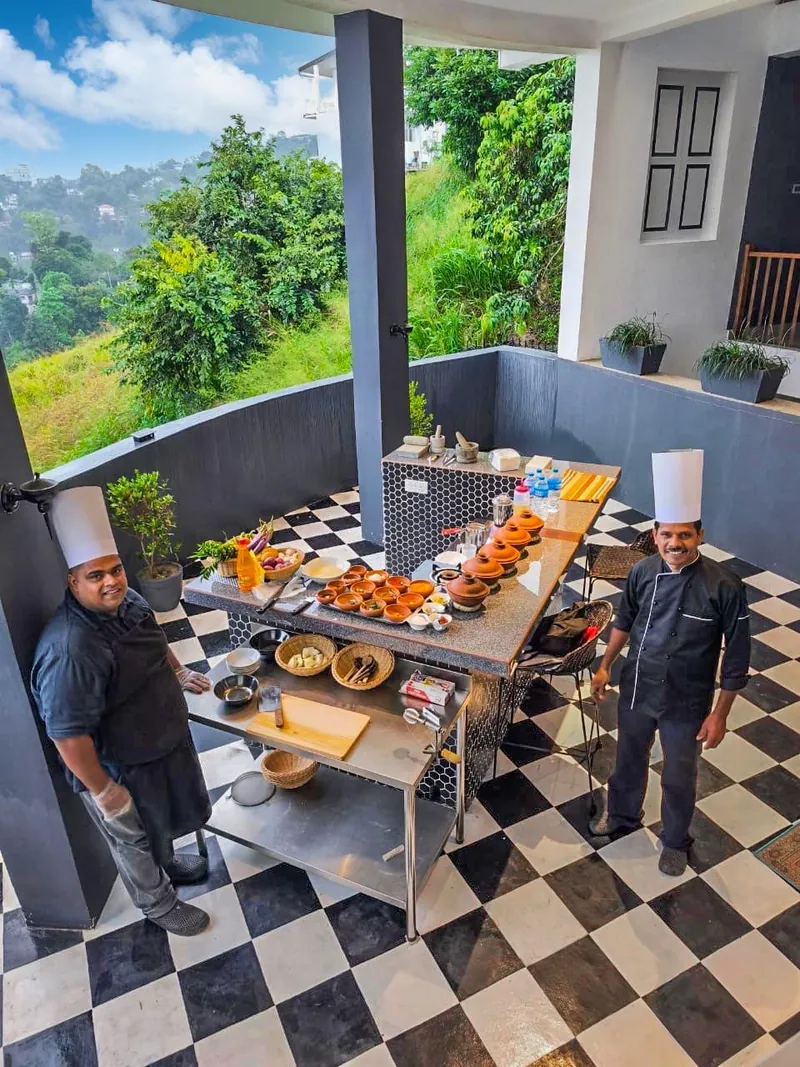 Chefs presenting a spread of dishes at the open-air terrace kitchen at The Summit Kandy