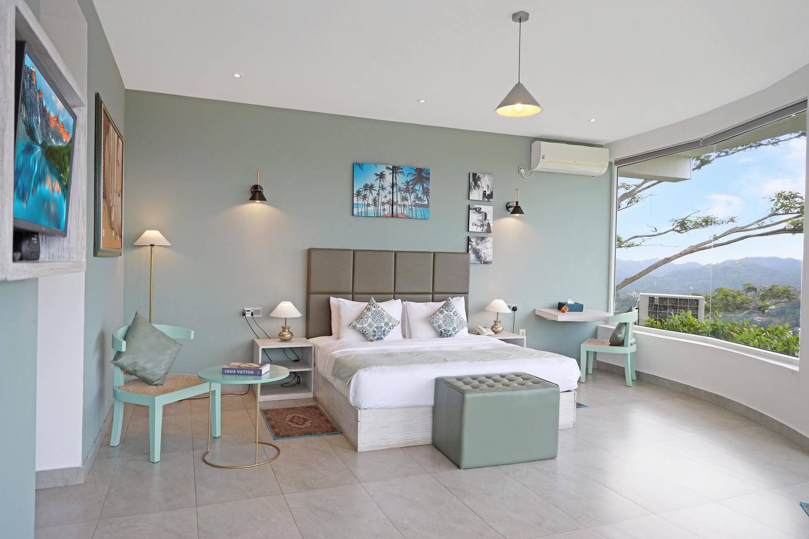 Spacious guest room at The Summit Kandy with a king bed and floor-to-ceiling windows overlooking the Kandy hills